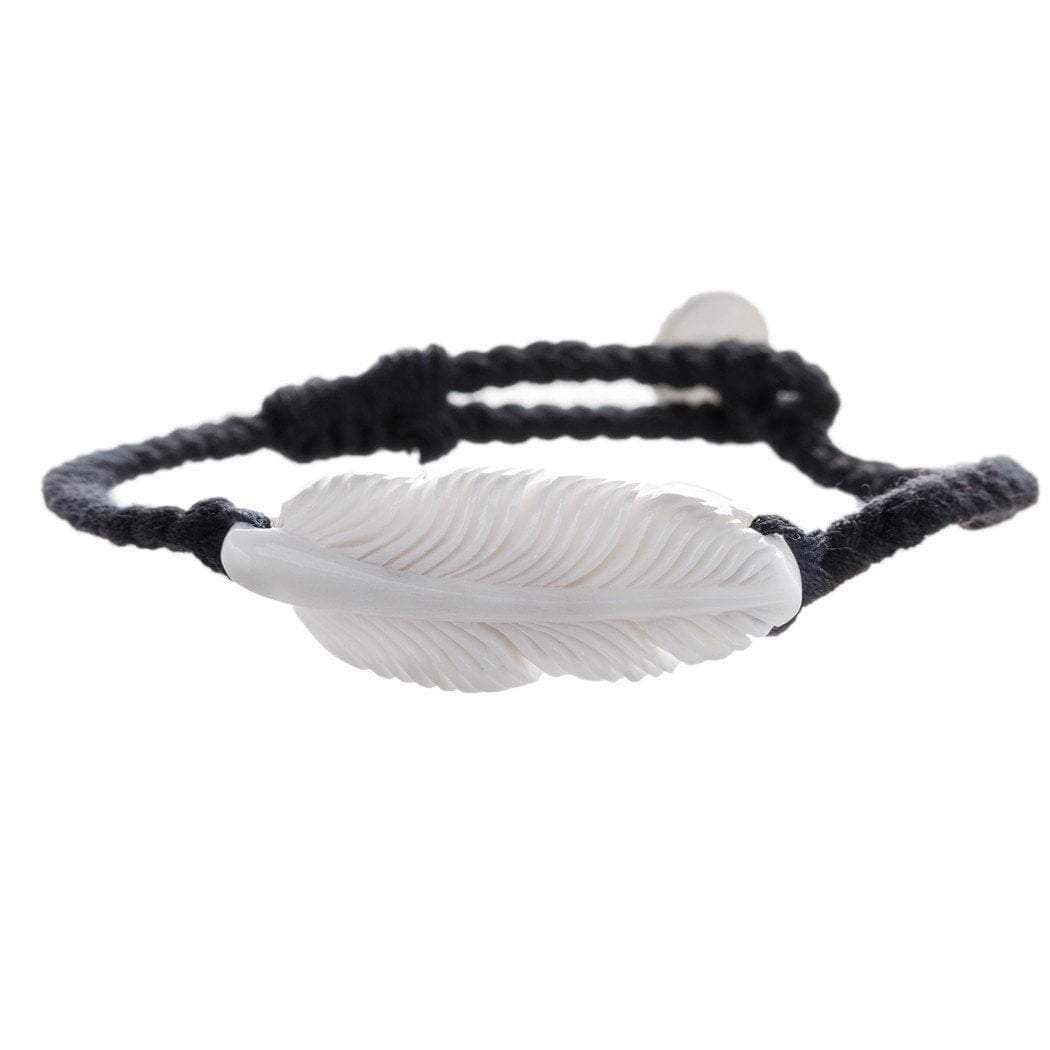 Hair wrap with friendship bracelet string, next to hair feathers